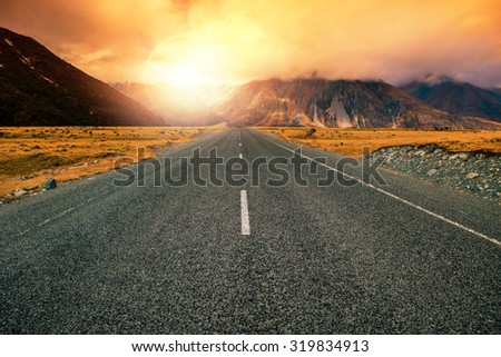 beautiful land scape of asphalt highways perspective to sun set mountain use for multipurpose natural background