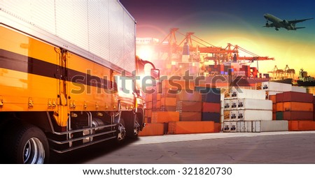 container truck in shipping port ,container dock and freight cargo plane flying above use for transportation and logistic industry