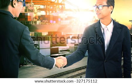 business man successful shake hand with joint venture cooperation in commercial shipping import export trading