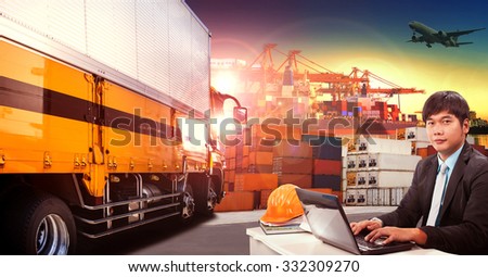 working man and container truck in shipping port ,container dock and freight cargo plane flying above use for transportation and logistic industry