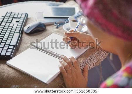 woman writing shot memories note on white paper with relaxing time and emotion