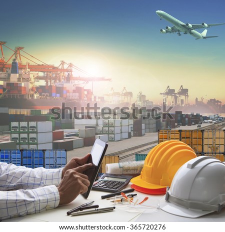 business man working table in container dock use for logistic industry and import export , freight cargo shipping theme