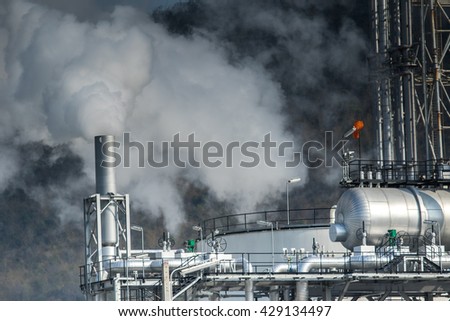 heavy industrial fog from exhaust tube in petrochemical  industry estate
