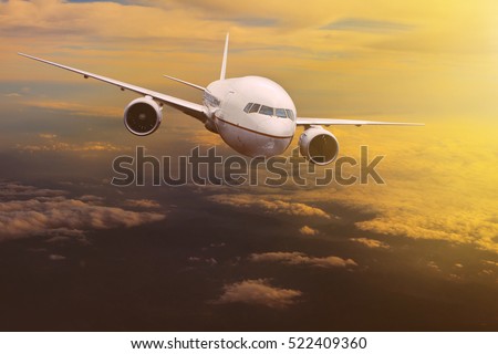 traveling plane flying over  sun rising sky