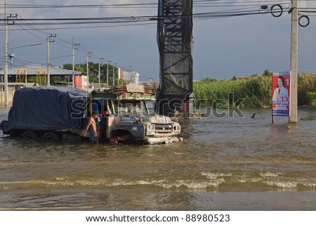 AYUTTHAYA THAILAND - OCT 14 : Phaholyothin road full area of higher flood water on october 14,2011 in Ayutthaya Thailand