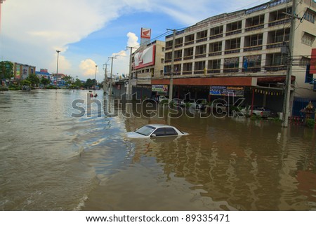 AYUTTHAYA THAILAND - OCT 14 : high level of flood water at Rojana Rd. on October 14,2011 in Ayutthaya Thailand