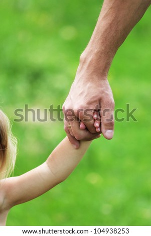 hand of a parent and child