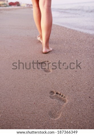 a  Women\'s footprints in the sand