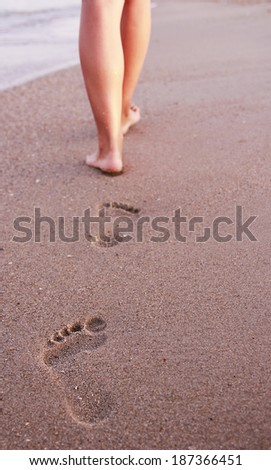 a  Women\'s footprints in the sand