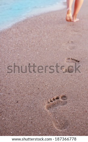 a Women\'s footprints in the sand