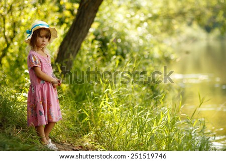a beautiful little girl on the nature
