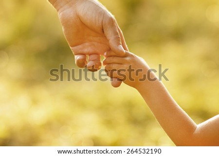 hand of parent and child