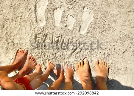 footprints in the sand with his feet