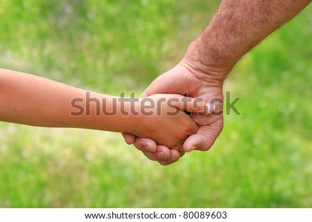 father gives her hand a child