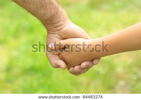 father gives her hand a child