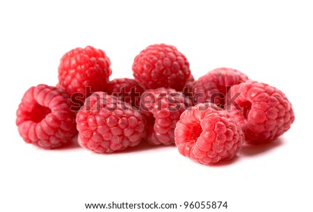 Composition of fresh ripe raspberries isolated on white background. Shallow depth of field.