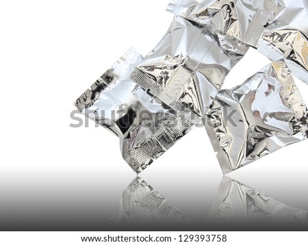 Foil package on reflect floor and white background