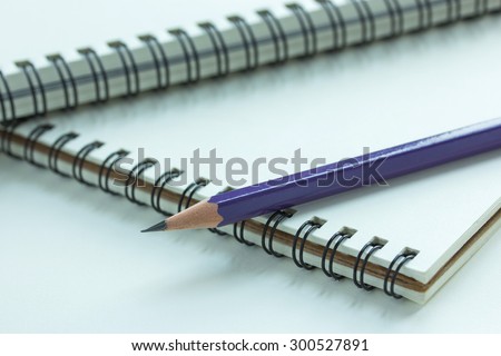 Close up pencil and spiral notebook, Selective focus point