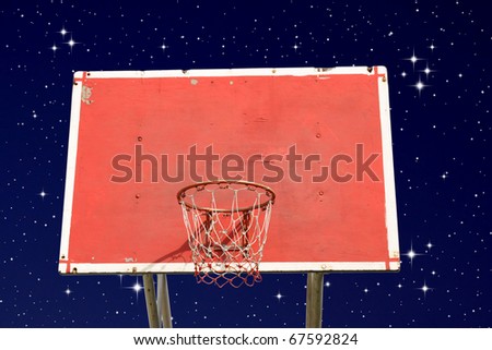 Outdoor basketball hoop on night sky