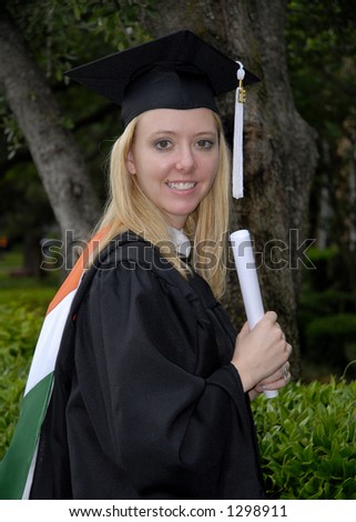 A photo of a young woman who has just received her master\'s degree.