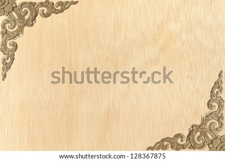 Pattern carved frame on wood background