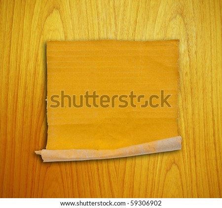 piece of corrugated cardboard on the wood background