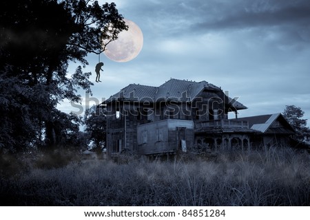 Haunted halloween house with full moon