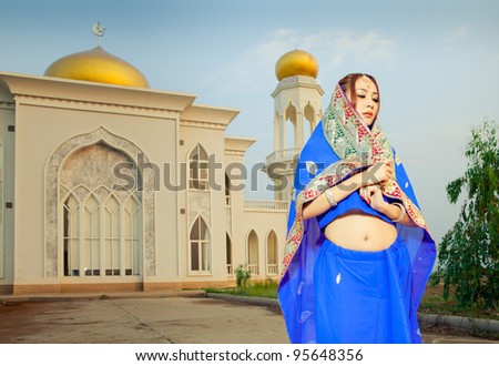 Muslim woman in front of the Mosque