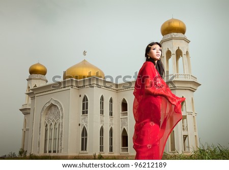 Muslim woman in front of the Mosque