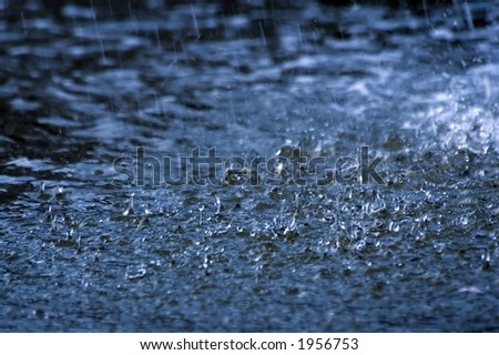 rain splashes on water