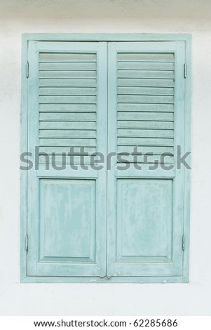 Retro green door on white wall