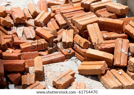 A group of brick lay on the ground