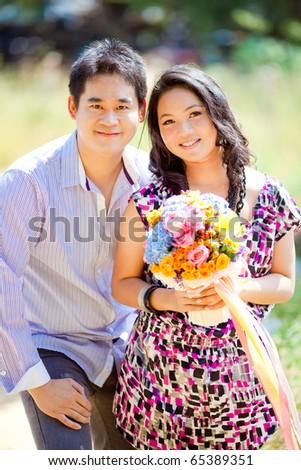 stock photo Pre wedding groom hold bride and bouquet