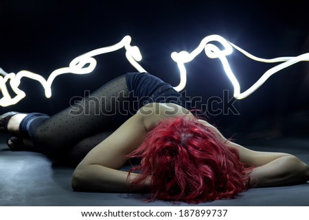 Women laying on the floor, light painting