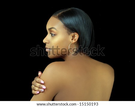 Profile portrait of young black woman with bare back