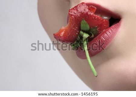 red lips is eating red strawberry