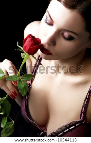 stock photo sensual woman with red rose is enjoying