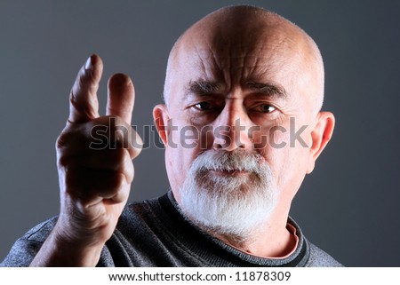 a portrait of a old man with angry face