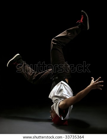 Break dance style dancer doing freeze position