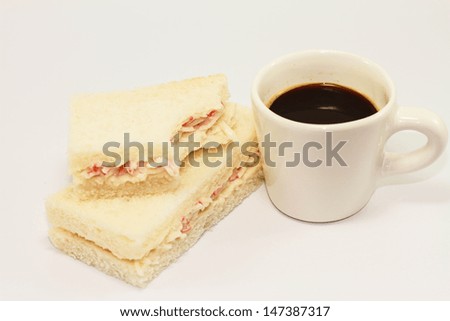 Japanese sandwiches and a cup of black coffee isolated on white background