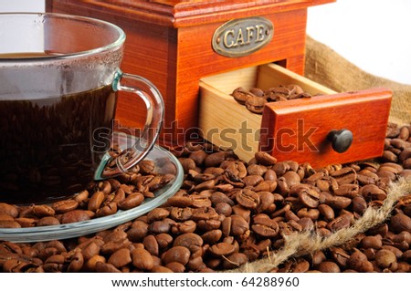 stock photo : Arrangement with the coffee grinder, coffee beans and a cup of coffee