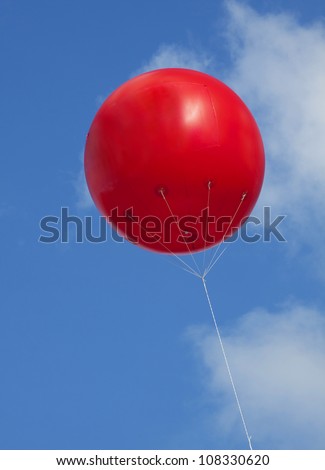 red advertising balloon in the blue sky