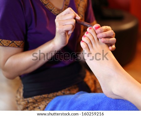 reflexology foot massage, spa foot treatment by wood stick,Thailand