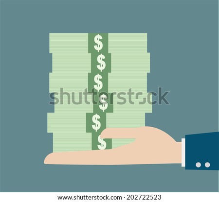 business hand holding stack money
