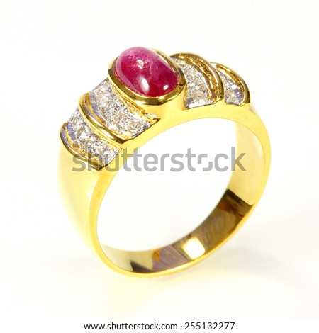 gold ring with ruby and diamond on white background