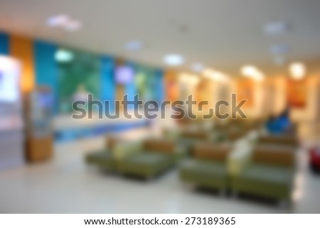 Blurred waiting chairs zone in hospital as background