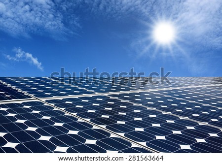 Solar panels produce energy from the sun with blue sky