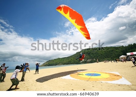 PHUKET, THAILAND - MAY 21: Paragliding festival, Phuket fun fly on May 21, 2010 in Nai-harn beach, Phuket, Thailand.