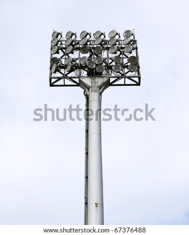 a football stadium floodlight with metal pole