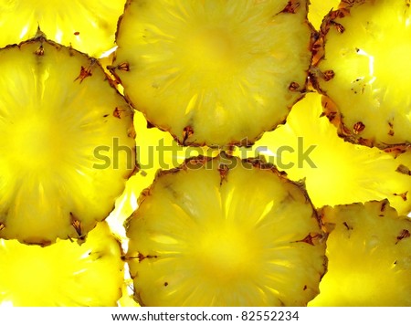 close up of pineapple slice on white background